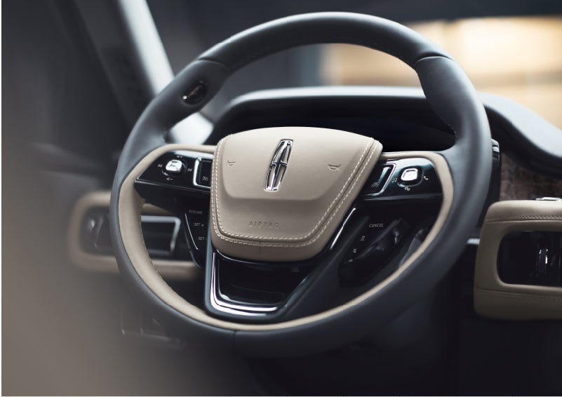 The intuitively placed controls of the steering wheel on a 2023 Lincoln Aviator® SUV | Wallace Lincoln in Fort Pierce FL