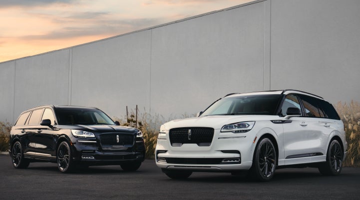 Two Lincoln Aviator® SUVs are shown with the available Jet Appearance Package | Wallace Lincoln in Fort Pierce FL
